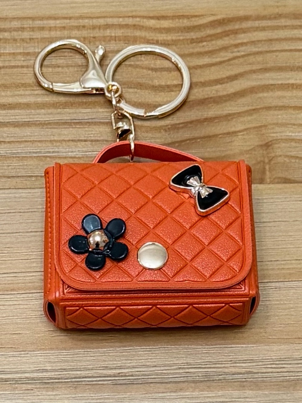 Orange Quilted Mini Bag Keychain with Black Flower & Bow